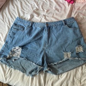 4xl women’s blue ripped shorts from Shein
